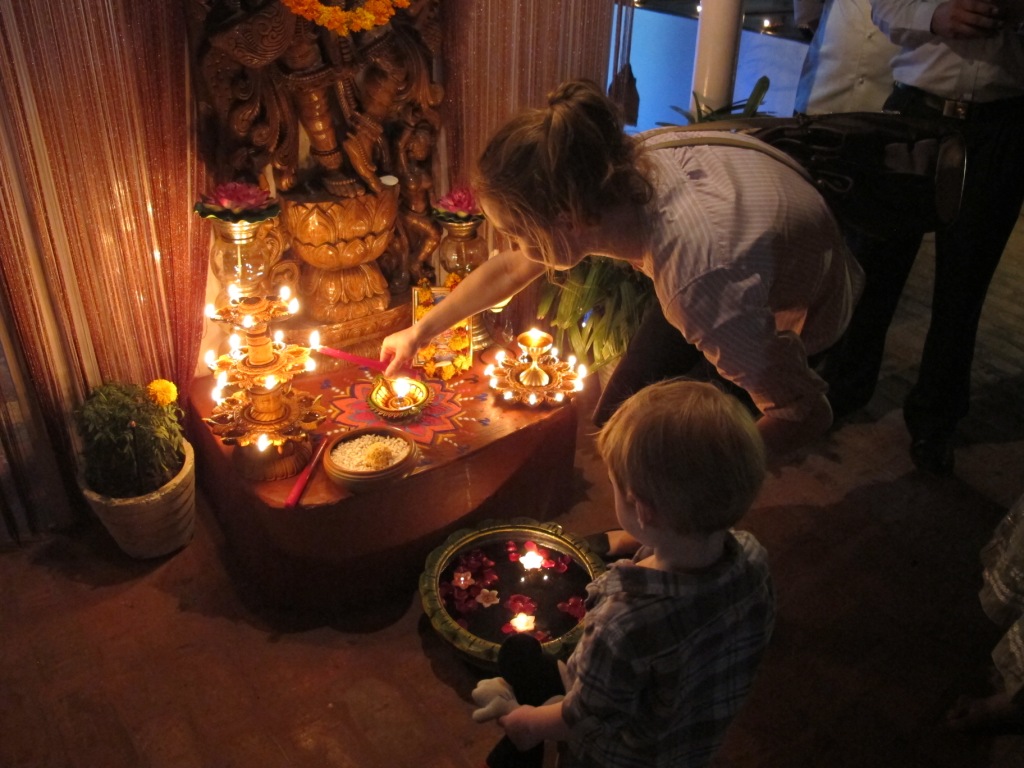 foreigner lighting divas and doing puja in india during diwali