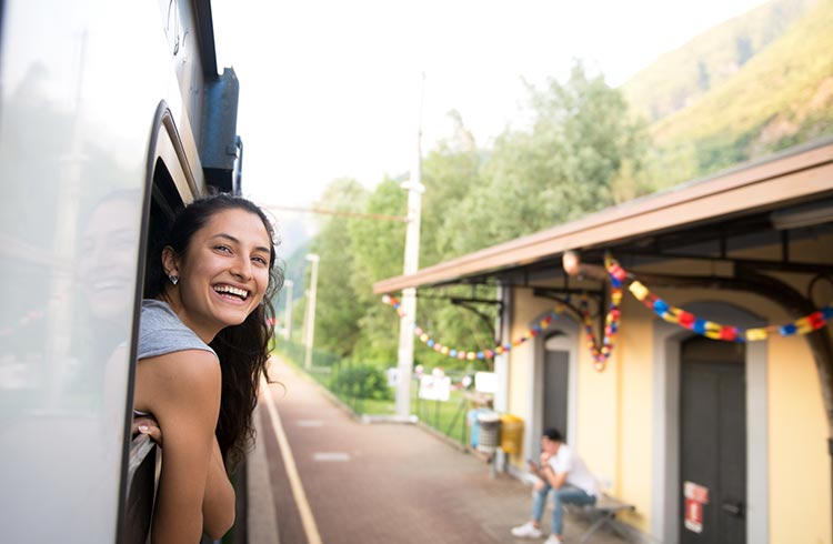 girl outside window of bus - fun places to hangout with friends in india