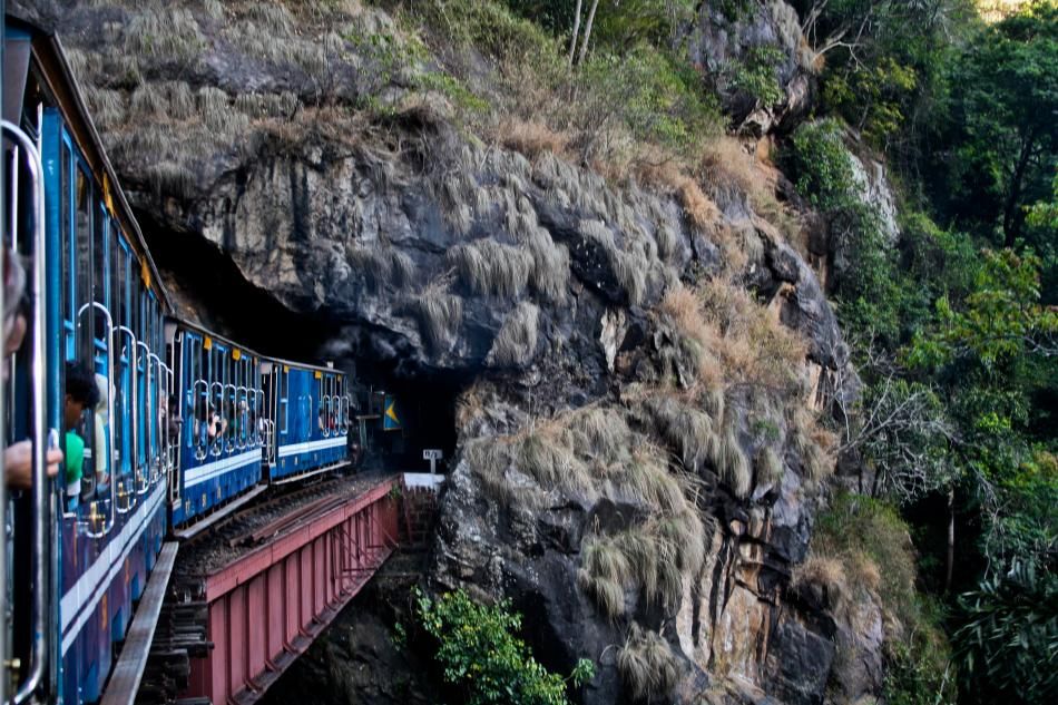 nilgiri mountain toy train in india running in cave