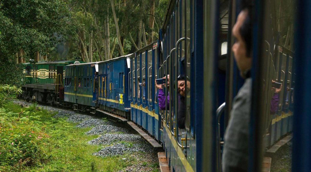 nilgiri mountain toy train in india running in forest