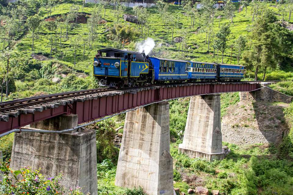 nilgiri mountain toy train in india running on bridge